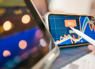 Multi-market trader analyzing Bitcoin, Ethereum, and forex options